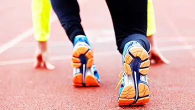 A professional runner preparing for the start on the start line