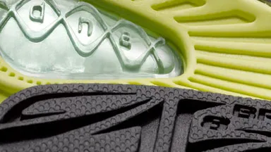 Sole of a tennis shoe showing soft touch and color